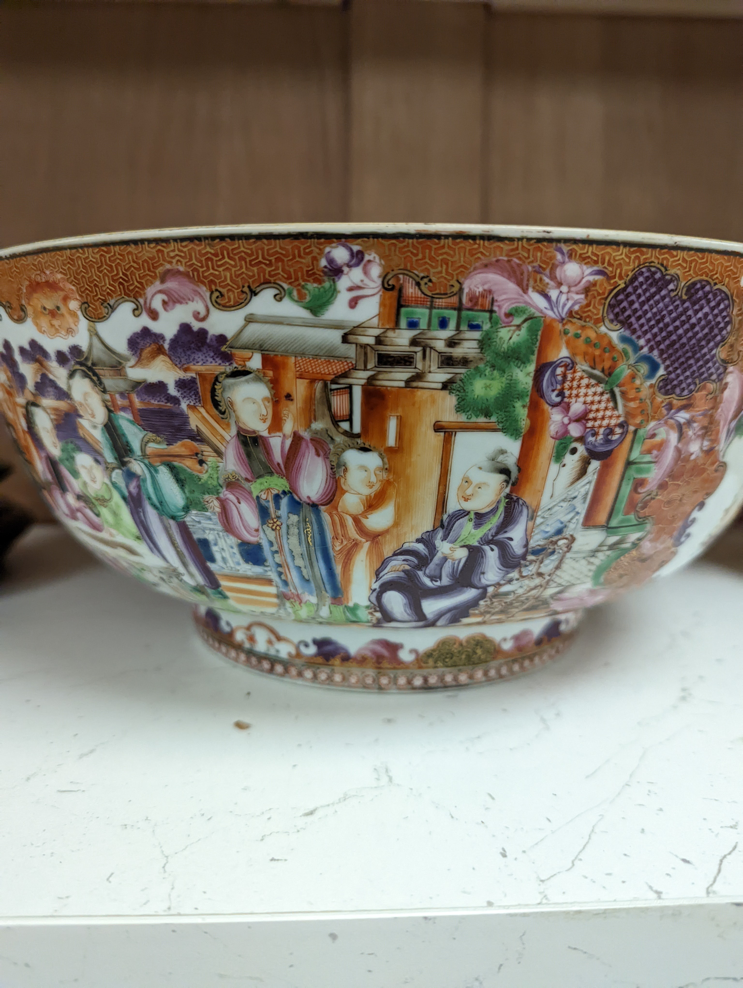 An 18th century Chinese export mandarin pattern porcelain bowl with hardwood stand 28.5cm diameter